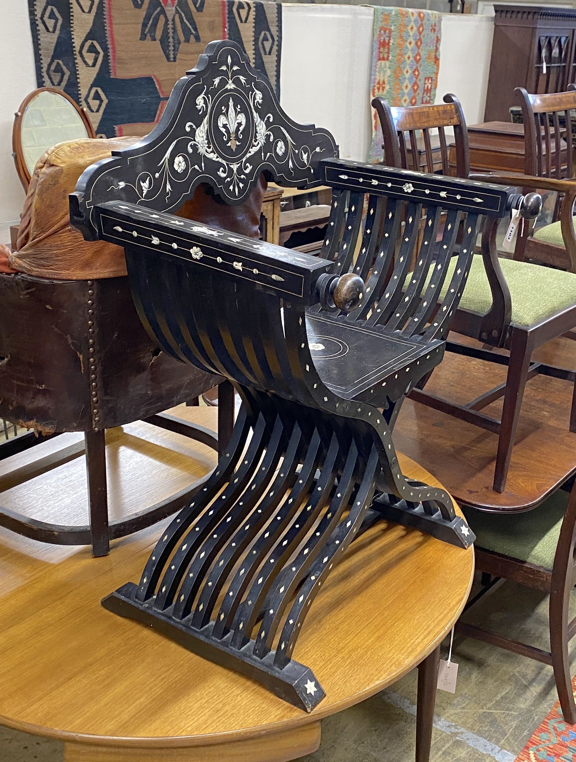 A 19th century Italian ebonised bone inlaid savonarola chair, width 72cm, depth 33cm, height 97cm